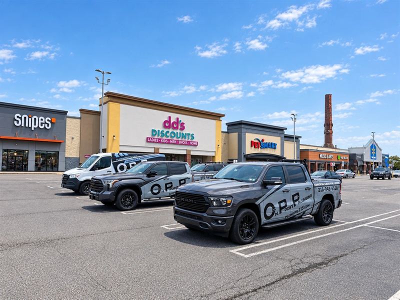 On Point Plumbing trucks at the SNIPES retail project in Northeast Philadelphia